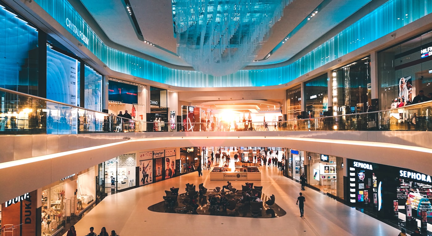 Interior of a busy shopping mall — retail / malls segment.